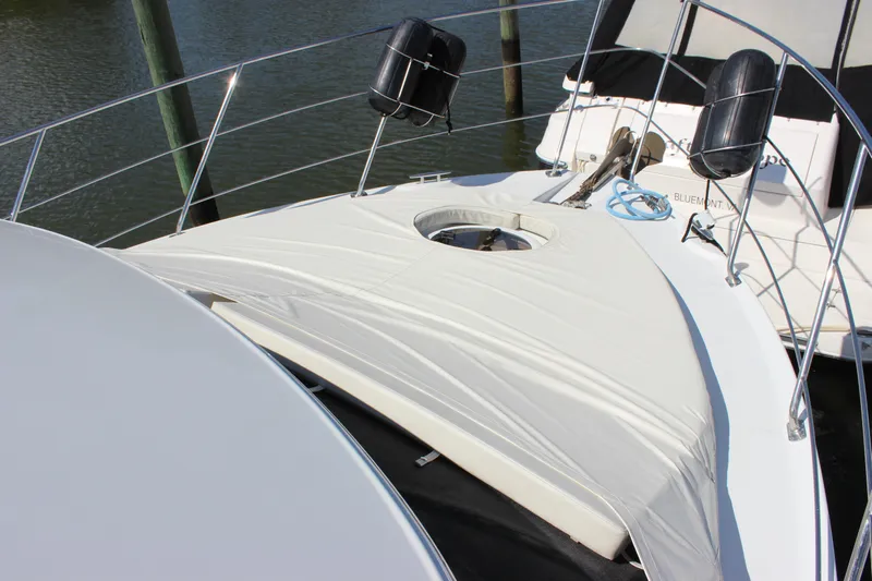  Yacht Photos Pics 2003 Carver 36 Super Sport yacht bow with protective cover and railing.