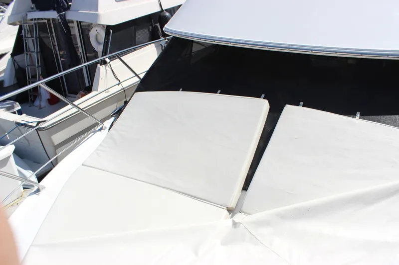  Yacht Photos Pics 2003 Carver 36 Super Sport yacht with sunbathing cushions on deck.