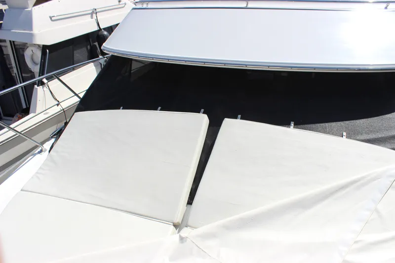  Yacht Photos Pics 2003 Carver 36 Super Sport yacht with sun pads on deck.