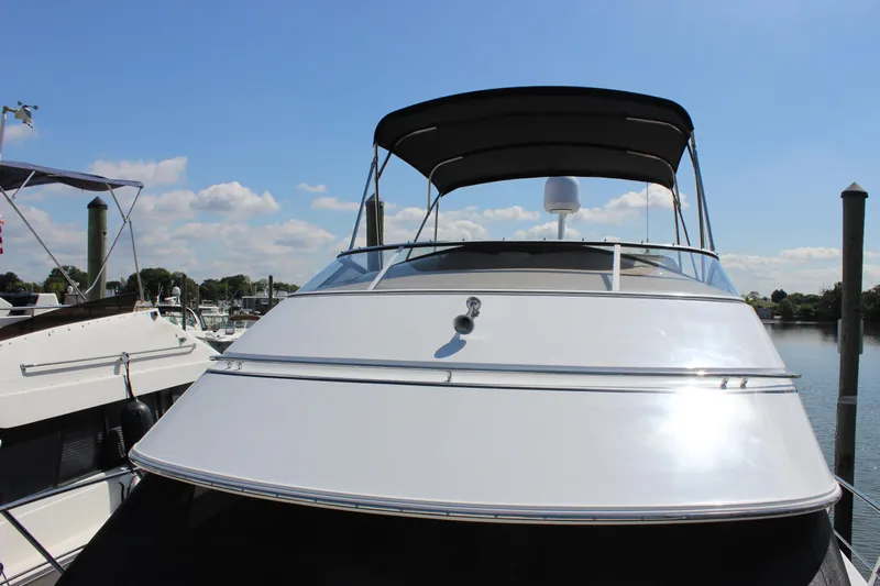  Yacht Photos Pics 2003 Carver 36 Super Sport yacht docked under clear blue sky.