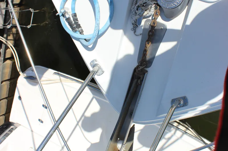  Yacht Photos Pics Bow of 2003 Carver 36 Super Sport with anchor chain and railing.