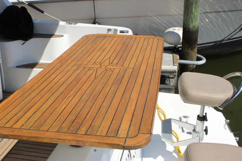  Yacht Photos Pics Teak table and seating on 2003 Carver 36 Super Sport yacht deck.