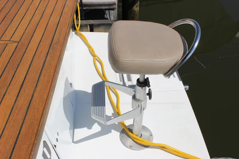  Yacht Photos Pics Adjustable seat on 2003 Carver 36 Super Sport boat deck with wooden flooring.