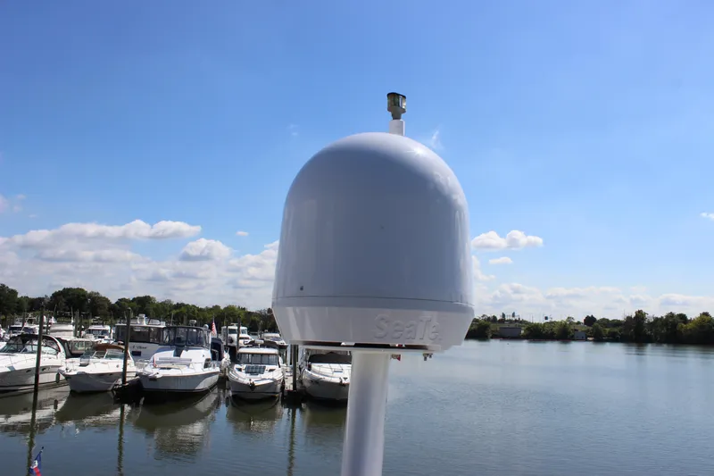  Yacht Photos Pics Marina view with Carver 36 Super Sport, 2003, under clear blue sky.