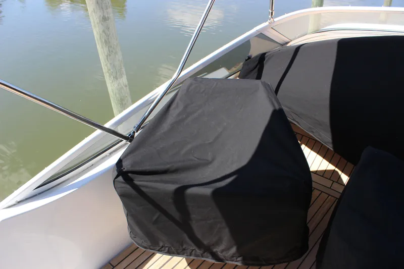  Yacht Photos Pics 2003 Carver 36 Super Sport boat deck with covered seating and railing.