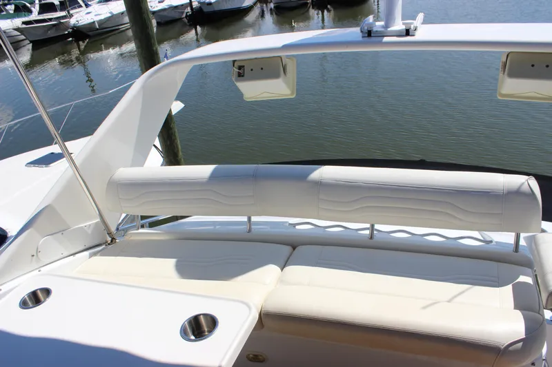  Yacht Photos Pics 2003 Carver 36 Super Sport yacht with white seating and cup holders, docked at marina.