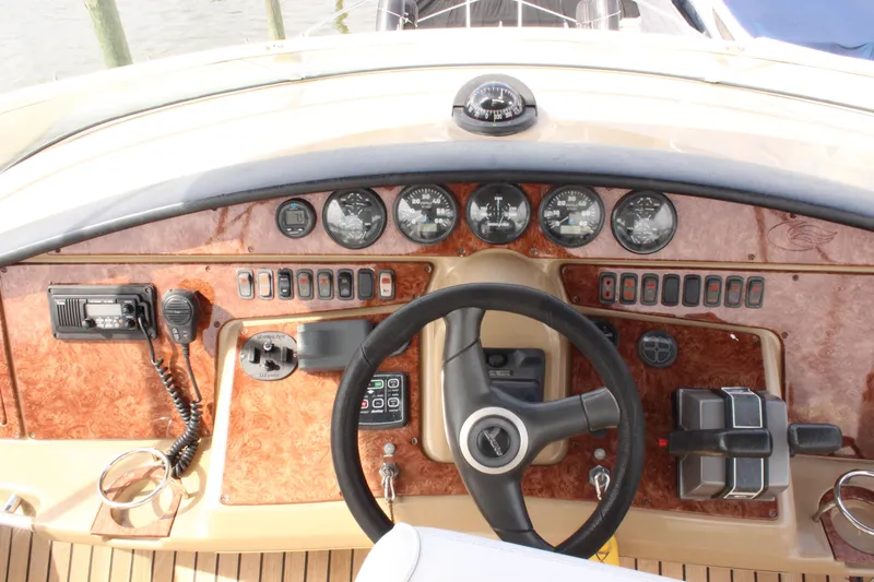  Yacht Photos Pics 2003 Carver 36 Super Sport dashboard with steering wheel and control panel.