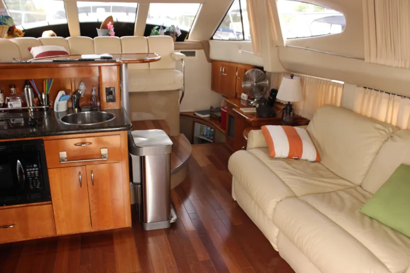  Yacht Photos Pics Luxurious interior of 2003 Carver 36 Super Sport yacht with kitchen and seating area.