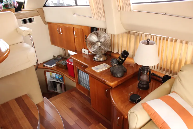  Yacht Photos Pics Interior of 2003 Carver 36 Super Sport yacht with wooden cabinetry and decor.