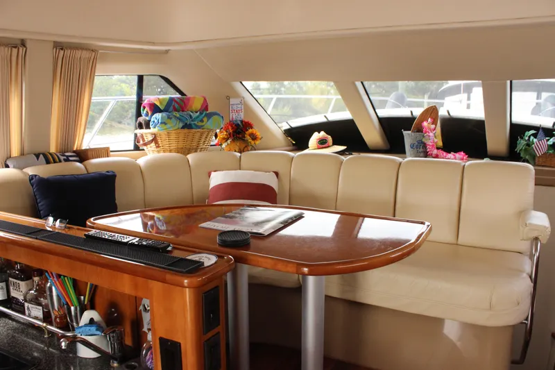  Yacht Photos Pics Luxurious interior of 2003 Carver 36 Super Sport yacht with plush seating and elegant decor.