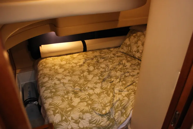  Yacht Photos Pics Cozy cabin interior of 2003 Carver 36 Super Sport with floral bedding.