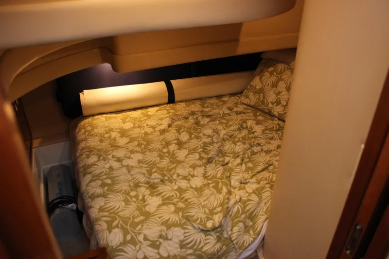  Yacht Photos Pics Cozy cabin interior of 2003 Carver 36 Super Sport with floral bedding.