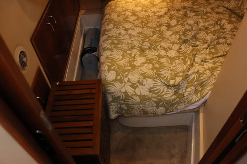  Yacht Photos Pics Cozy cabin interior of 2003 Carver 36 Super Sport with floral bedding.