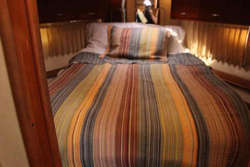  Yacht Photos Pics Cozy bedroom in 2003 Carver 36 Super Sport yacht with striped bedding.