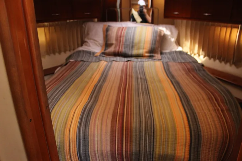  Yacht Photos Pics Cozy cabin interior of 2003 Carver 36 Super Sport with striped bedding.