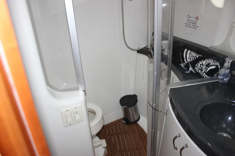  Yacht Photos Pics Bathroom interior of 2003 Carver 36 Super Sport yacht with shower and sink.