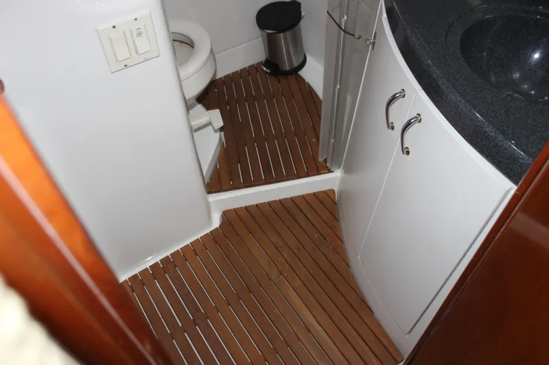  Yacht Photos Pics Bathroom interior of 2003 Carver 36 Super Sport yacht with wooden flooring.