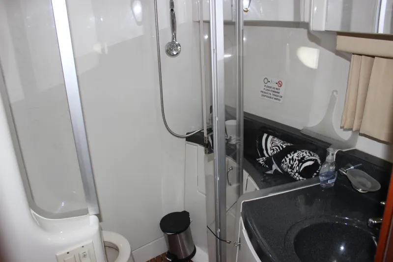  Yacht Photos Pics Bathroom interior of 2003 Carver 36 Super Sport yacht with shower and sink.