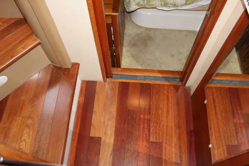  Yacht Photos Pics Interior of 2003 Carver 36 Super Sport with wooden flooring and stairs.