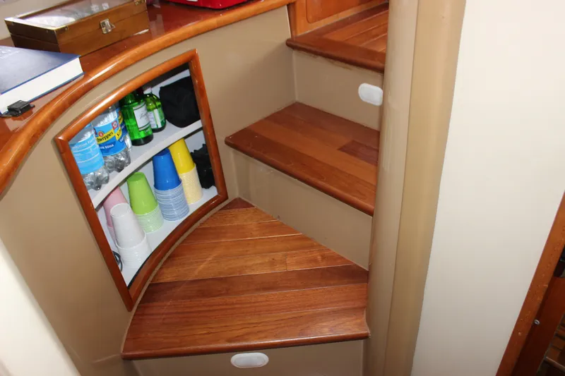  Yacht Photos Pics Interior of 2003 Carver 36 Super Sport with wooden stairs and built-in storage shelves.