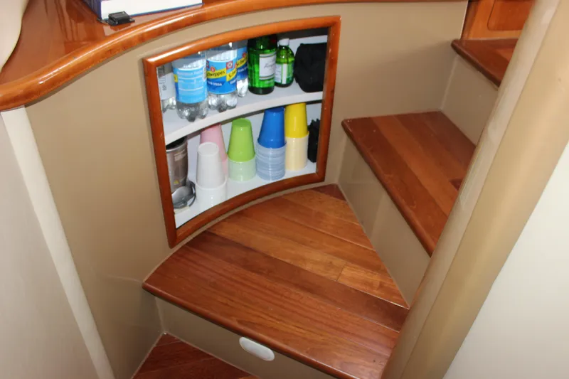  Yacht Photos Pics Interior of 2003 Carver 36 Super Sport with wooden steps and storage shelves.