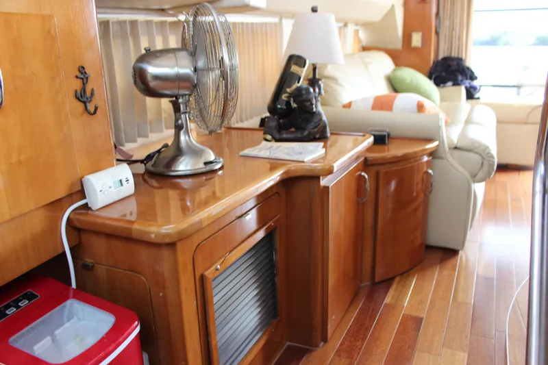  Yacht Photos Pics Interior of 2003 Carver 36 Super Sport yacht with wooden cabinetry and modern decor.