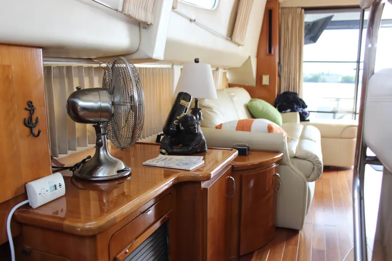  Yacht Photos Pics Interior of 2003 Carver 36 Super Sport yacht with wooden furnishings and cozy seating area.