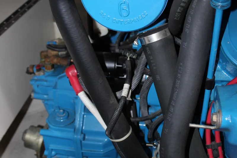  Yacht Photos Pics Engine compartment of a 2003 Carver 36 Super Sport boat, featuring hoses and components.