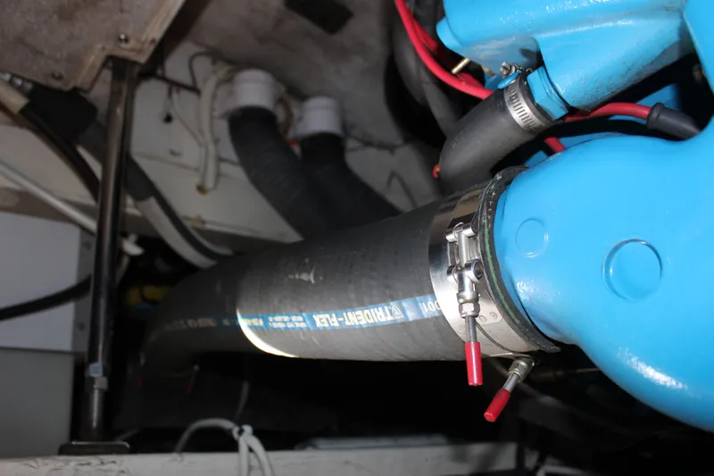  Yacht Photos Pics Engine compartment of a 2003 Carver 36 Super Sport with hoses and blue engine parts.