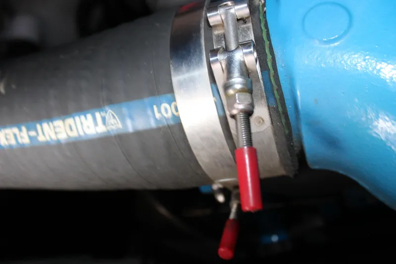  Yacht Photos Pics Close-up of a hose clamp on a Carver 36 Super Sport 2003 boat engine.
