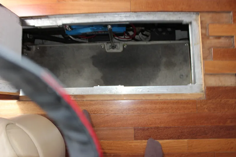  Yacht Photos Pics Open hatch on 2003 Carver 36 Super Sport boat, revealing interior compartment.