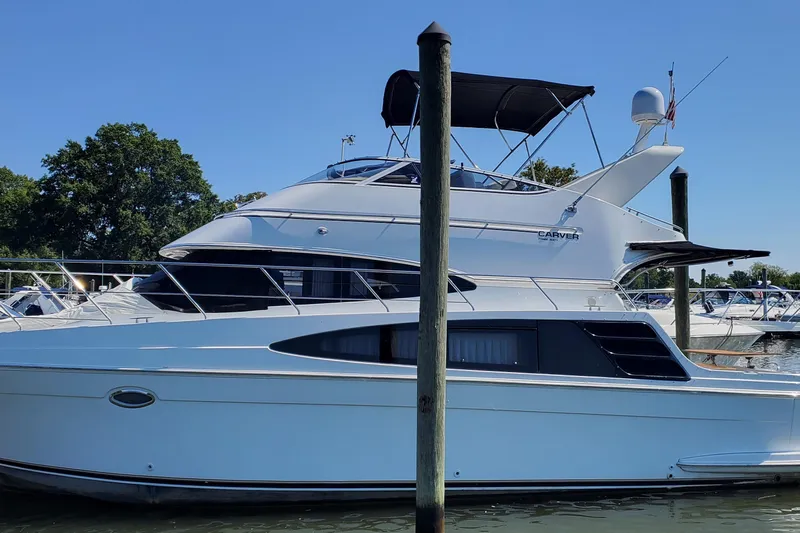  Yacht Photos Pics 2003 Carver 36 Super Sport yacht docked at marina under clear blue sky.