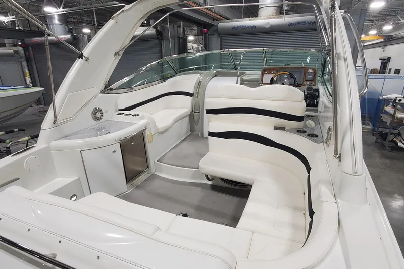  Yacht Photos Pics 2010 Formula 31 Performance Cruiser interior with white seating and modern dashboard.