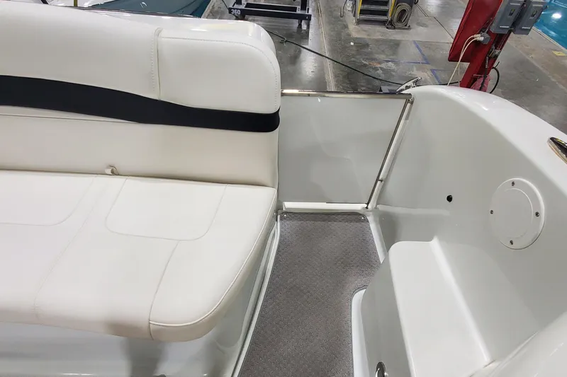  Yacht Photos Pics 2010 Formula 31 Performance Cruiser interior with white seating and carpeted floor.