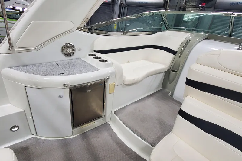  Yacht Photos Pics 2010 Formula 31 Performance Cruiser interior with seating and mini fridge.