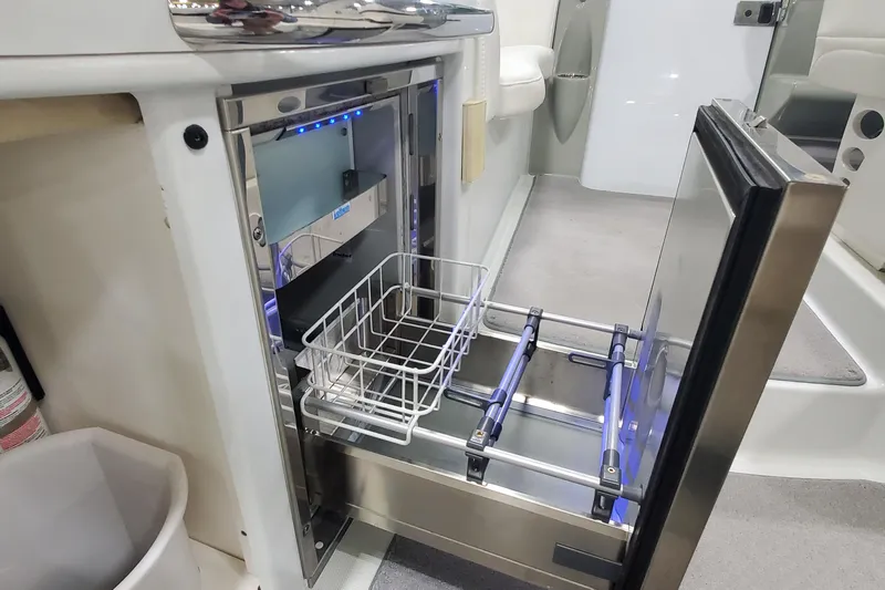  Yacht Photos Pics 2010 Formula 31 Performance Cruiser interior with open stainless steel drawer and basket.