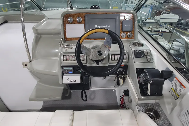  Yacht Photos Pics 2010 Formula 31 Performance Cruiser helm with Raymarine navigation system and ICOM radio.