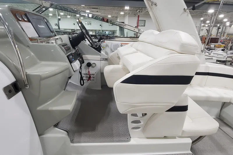  Yacht Photos Pics 2010 Formula 31 Performance Cruiser interior with white seating and modern dashboard.