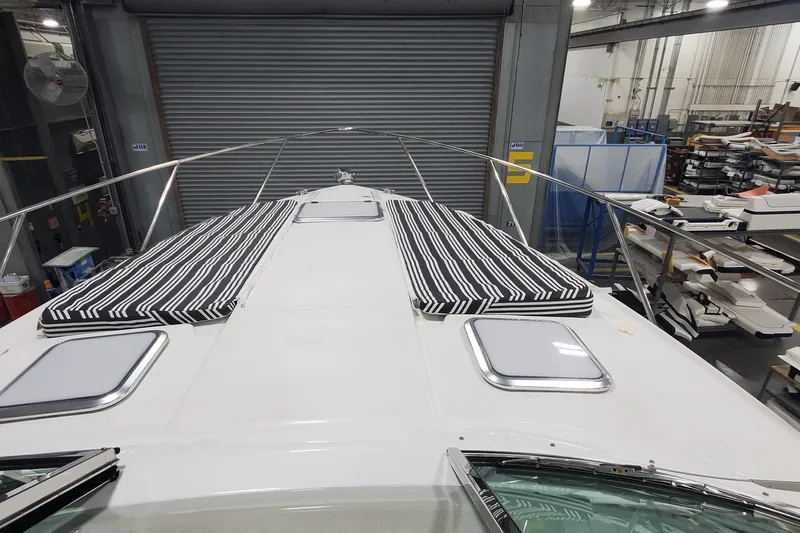  Yacht Photos Pics 2010 Formula 31 Performance Cruiser with striped cushions in a workshop setting.