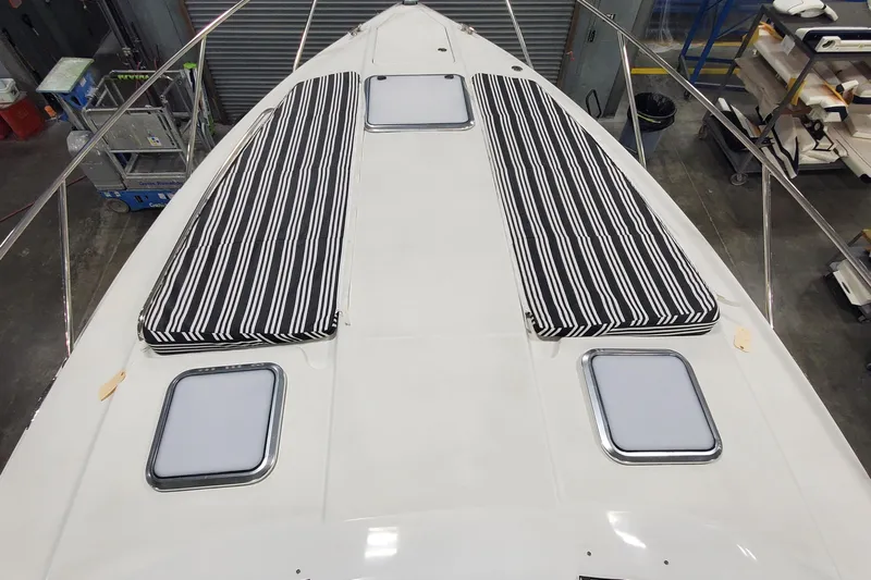 Yacht Photos Pics 2010 Formula 31 Performance Cruiser deck with striped cushions and hatches.