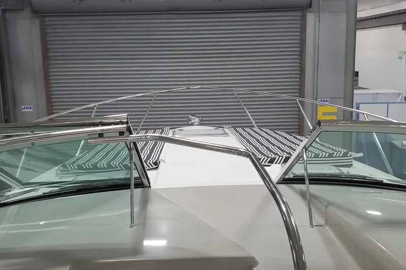  Yacht Photos Pics 2010 Formula 31 Performance Cruiser in a garage, featuring sleek design and striped cushions.