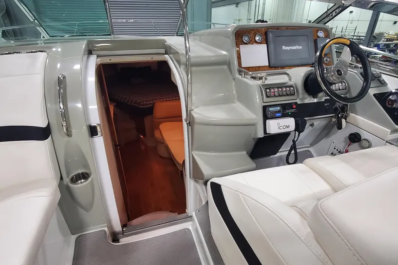  Yacht Photos Pics 2010 Formula 31 Performance Cruiser interior with helm, seating, and cabin entrance.