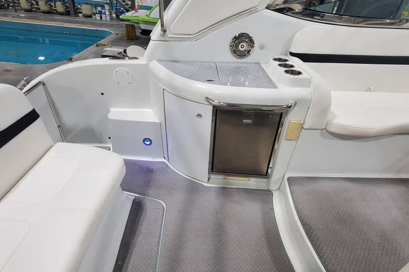  Yacht Photos Pics 2010 Formula 31 Performance Cruiser interior with seating, mini fridge, and countertop.