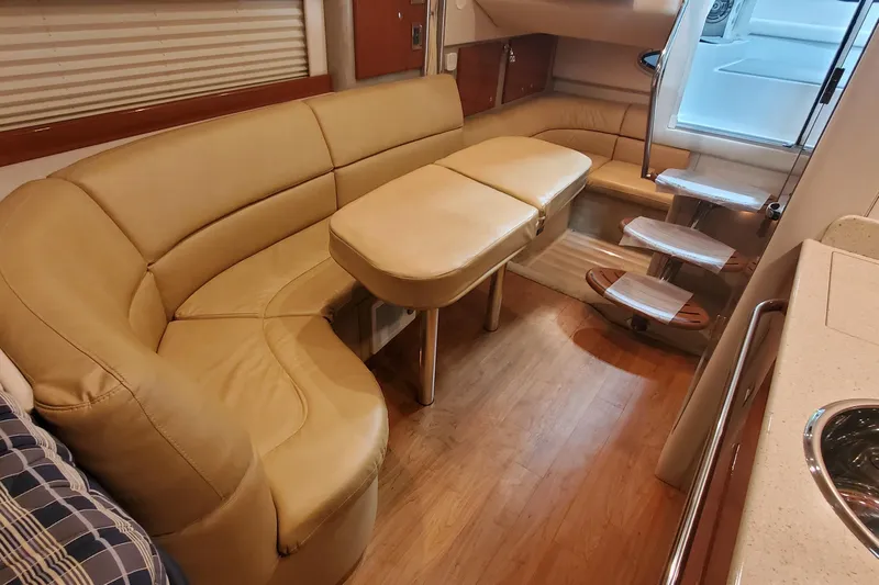  Yacht Photos Pics Interior of 2010 Formula 31 Performance Cruiser with beige seating and wooden flooring.