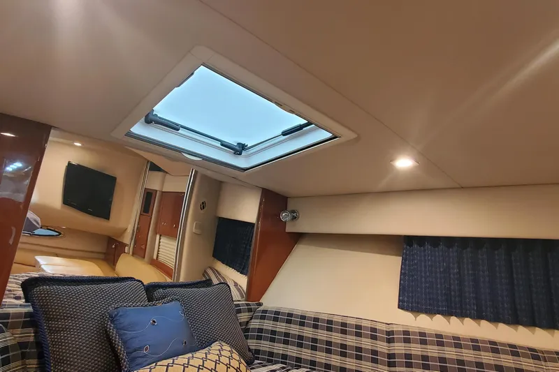  Yacht Photos Pics Interior of 2010 Formula 31 Performance Cruiser with skylight and plaid seating.