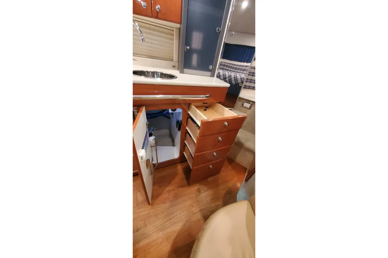  Yacht Photos Pics 2010 Formula 31 Performance Cruiser interior with open cabinets and drawers.