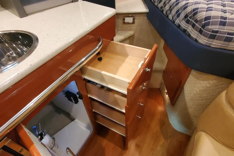  Yacht Photos Pics Interior of 2010 Formula 31 Performance Cruiser with open drawers and kitchenette.