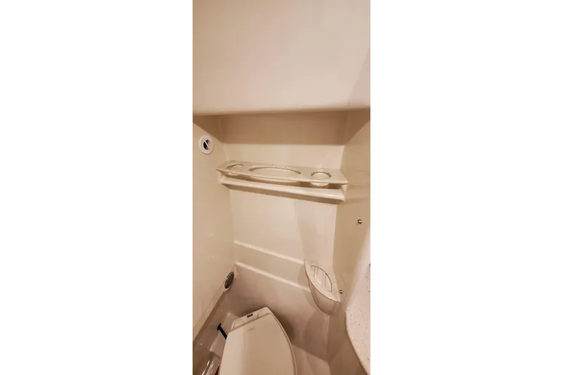  Yacht Photos Pics 2010 Formula 31 Performance Cruiser bathroom interior with toilet and shelf.