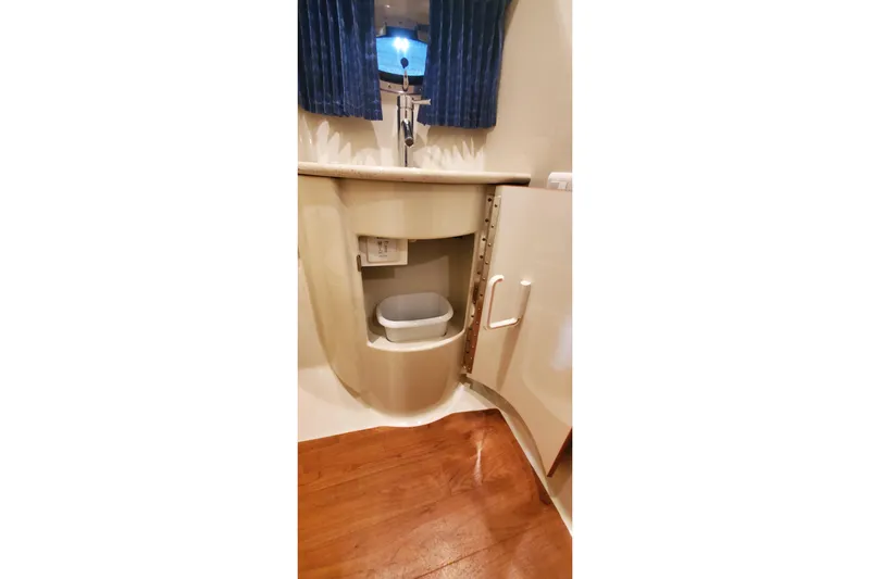  Yacht Photos Pics 2010 Formula 31 Performance Cruiser bathroom with sink, cabinet, and wooden flooring.