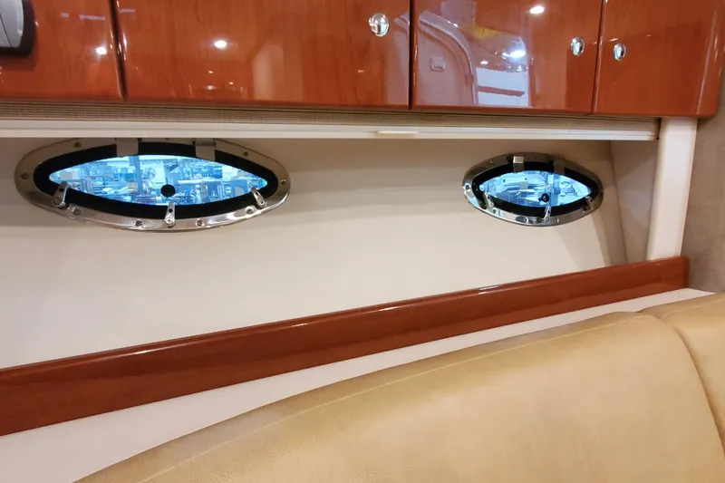  Yacht Photos Pics Interior of 2010 Formula 31 Performance Cruiser with portholes and wooden cabinetry.